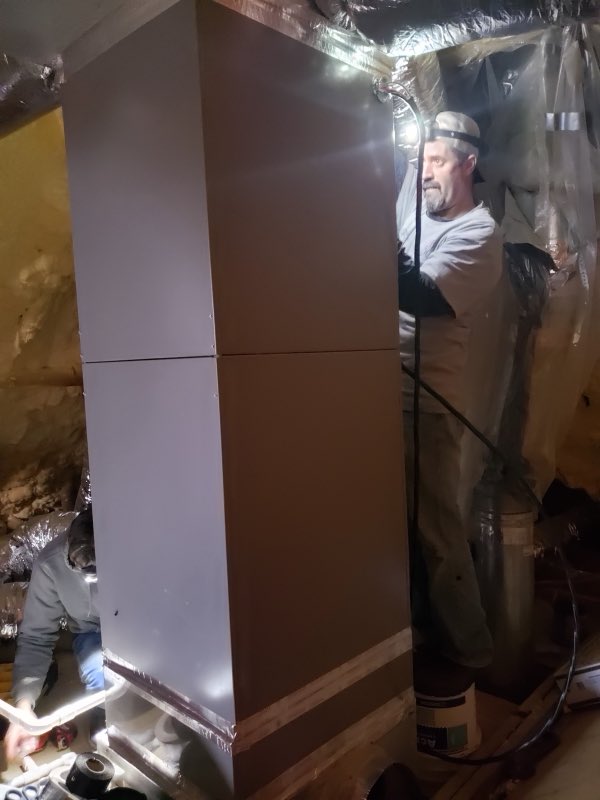 2B Cool HVAC technician installing a furnace and air handler with insulated ductwork